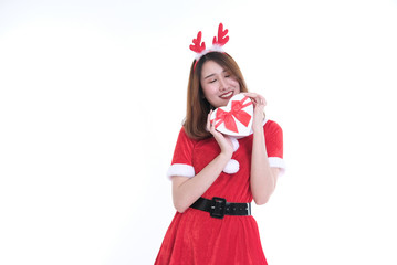 portrait of asian woman in santa claus dress on white background. girl with gift present box. christmas holiday. merry xmas celebration.