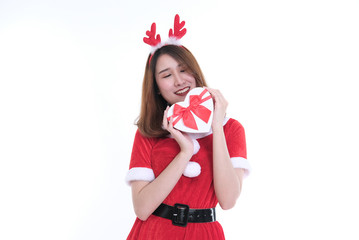 Fototapeta premium portrait of asian woman in santa claus dress on white background. girl with gift present box. christmas holiday. merry xmas celebration.