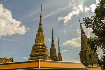 Fototapeta premium Pagoda is in Wat Pho that was named as the temple of the pagoda or chedi that are decorated with yellow glaze or glazed tiles or dark blue. 