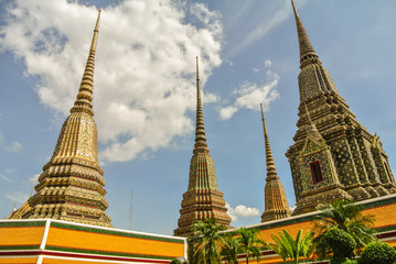 Fototapeta premium Pagoda is in Wat Pho that was named as the temple of the pagoda or chedi that are decorated with yellow glaze or glazed tiles or dark blue. 