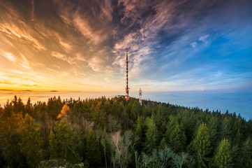 radio tower on mountain Klet in south bohemia during sunset