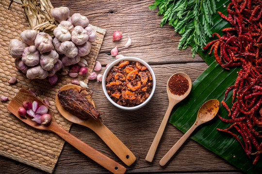 thai tradition style spicy dipping mad frop pork and shirmp with spicy and herb for ingredient on wooden texture table