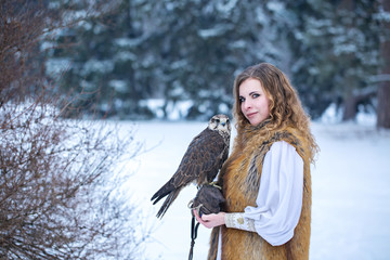 red-haired woman with a falcon