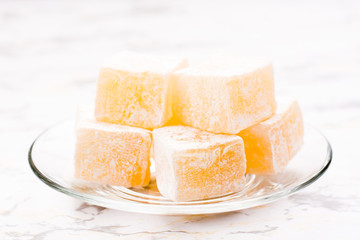 Pieces of Turkish Delight. on a plate