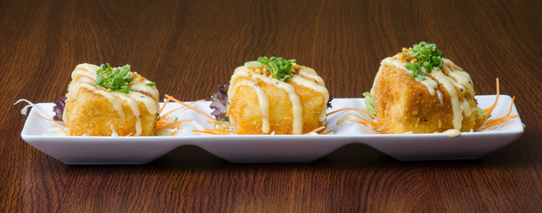 japanese cuisine. fried tofu on the background