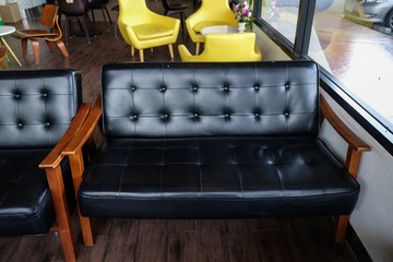 Luxury leather sofa wood arm in vintage cafe