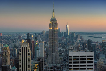 New York City skyline with urban skyscrapers at sunset, NY, USA. - obrazy, fototapety, plakaty