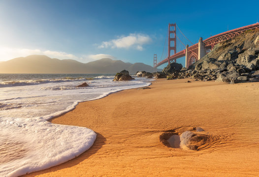 Golden Gate Bridge at Sunset Seen from Marshall Beach, San Francisco, California.
