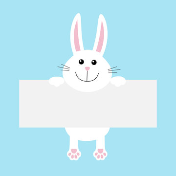 Funny white rabbit hare hanging on paper board template. Kawaii animal body with pawprint. Cute cartoon character. Baby card. Flat design style. Blue background Isolated