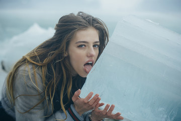 woman with pretty face lick ice block.