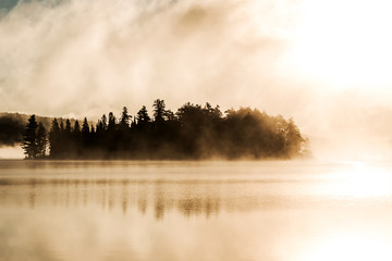 Lake of two rivers algonquin national park ontario canada sunset sunrise with fog foggy mystical atmosphere background