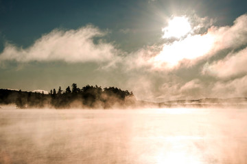 Lake of two rivers algonquin national park ontario canada sunset sunrise with fog foggy mystical atmosphere background