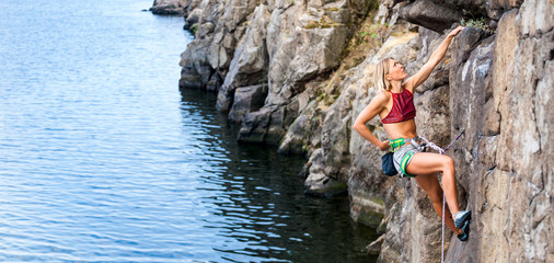 girl climbs the rock