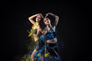 Portrait of two asian belly dancer perform with colorful paint