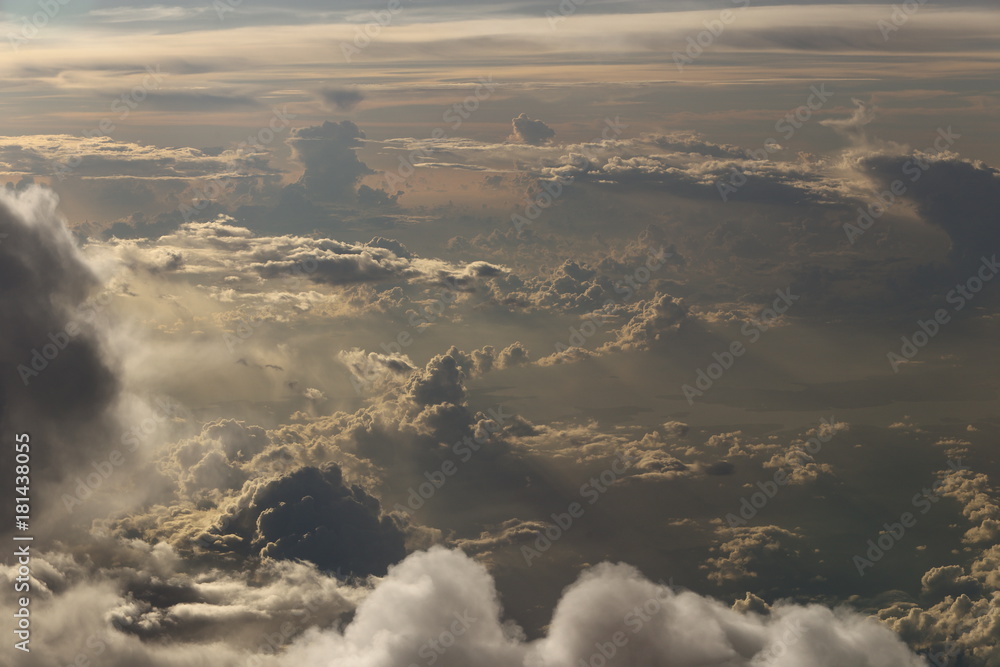 Wall mural sunset white cloud sky at high level attitude, view from window airplane