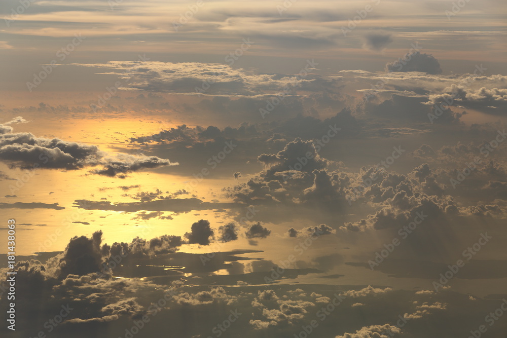 Wall mural sunset white cloud sky at high level attitude, view from window airplane