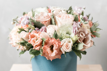 Luxury bouquets of mix flowers in the hat box. vintage color