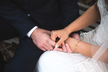 Obraz na płótnie Canvas Bride and Groom Holding Hands