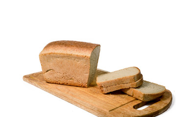 Isolated sliced bread on a wooden board, environmentally friendly product