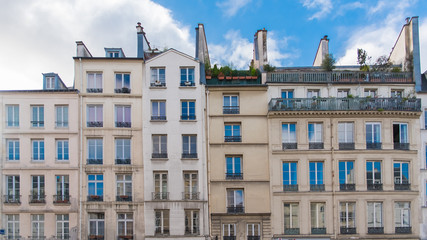 Fototapeta na wymiar Paris, typical facades in the center, old narrow buildings 