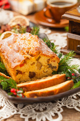 Christmas fruitcake. Natural wooden background.