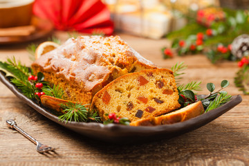Christmas fruitcake. Natural wooden background.