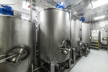 Large steel mixing tanks, modern production of spirits.