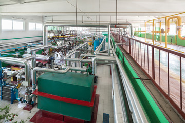 Modern boiler room. Complex system of tanks, pipelines, pumps and valves.
