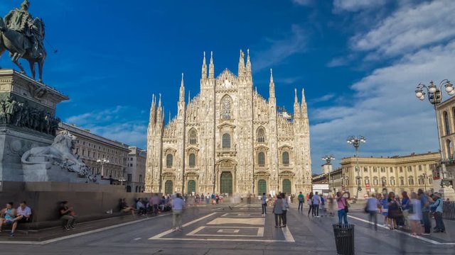 The famous Milan Cathedral timelapse hyperlapse and monument to Victor Emmanuel II on the Piazza del Duomo in Milan, Italy.