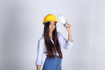 Beautiful Asian Architect Engineer woman in yellow hard hat