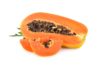 half cut ripe papaya with seed and leaf on white background