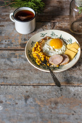 fried eggs for breakfast and a mug of tea