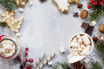 Christmas frame. A cup of hot chocolate and gingerbread, Christmas gifts on the table. Flat lay, top view with copy space.