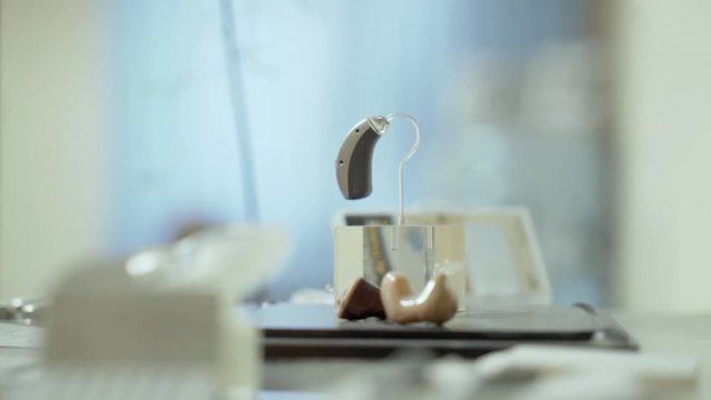 A sample of the hearing aid in the display case.