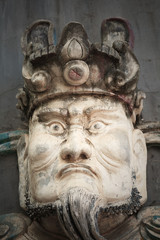 Stone scultpur with scary face