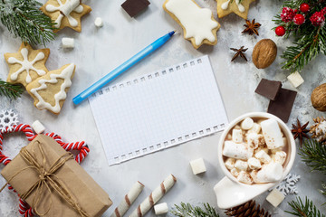 Christmas background. Christmas table decor, hot chocolate and writing congratulations. Flat lay, top view with copy space.