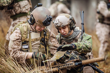 special forces soldiers with weapon take part in military maneuver. war, army, technology and people concept.