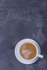 Coffee with milk on dark background