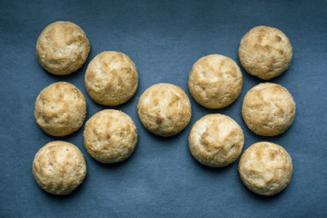 Fototapeta premium round homemade cookies, laid out in a bow tie on a blue background