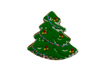 Christmas gingerbread cookie made in shape of Christmas tree isolated on white background