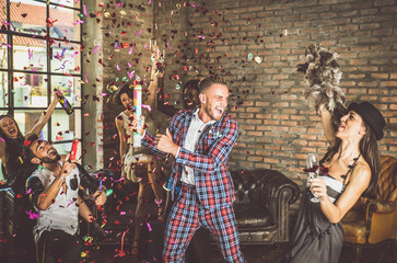 Group of friends celebrating and making party