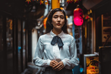 Beautiful japanese girl walking in Tokyo. Concept about teenagers and school