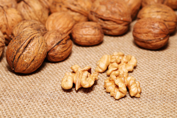 Walnuts against the background of cloth burlap