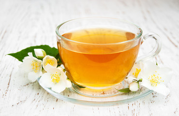 Cup of tea with jasmine flowers