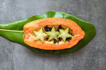 carambole and papaya fruits composition