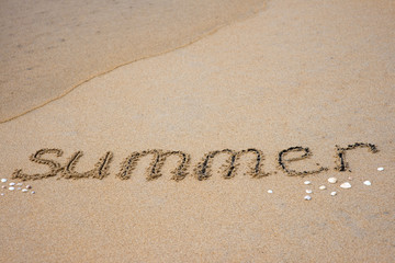 summer inscription on sand