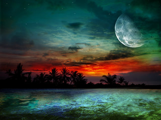 The ocean, sunset and moon