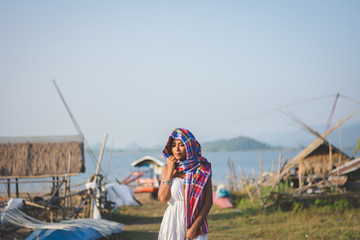 Portrait of beautiful Asian woman walking in village , enjoy natural outdoor at mariner village