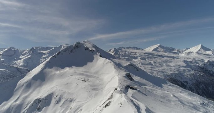 Aerial view of snowy mountains and ski slopes