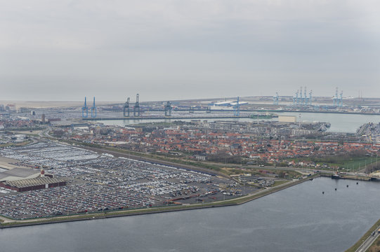Aerial image of Zeebrugge surrounded by its Port with Internatial Car Operators Benelux terminal (ICO terminals), Kiwiweg in the foreground
